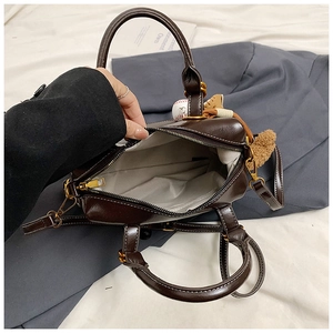 Interior view of vintage Boston bag showing light grey fabric lining and spacious capacity