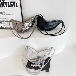 Minimalist crescent shoulder bags in metallic silver and black with pleated texture