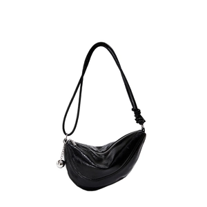 Minimalist black glossy crescent shoulder bag with knot strap and silver ball charm