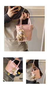 Pink bucket bag detail with teddy bear pendant and detachable shoulder strap views
