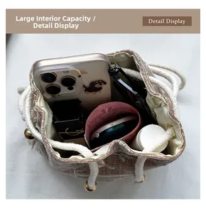 Close-up of embroidered drawstring bucket bag interior showing spacious storage capacity