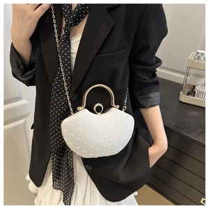 Chic white evening bag with pearl-style embroidery and gold circular metal handles