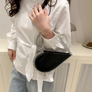 Elegant black heart-shaped evening clutch with sparkling silver rhinestones and handle