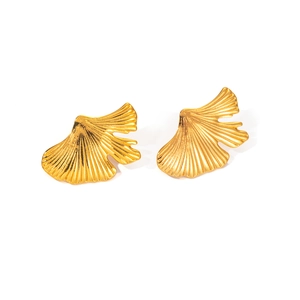 Detailed view of golden ginkgo leaf earrings with fine radial textures and wavy edges