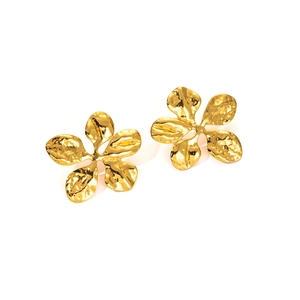 Detail of gold flower earrings with hammered metal texture and five-petal design