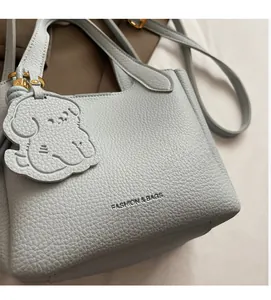Close-up of pebble leather texture and fashion embossing on a bucket handbag