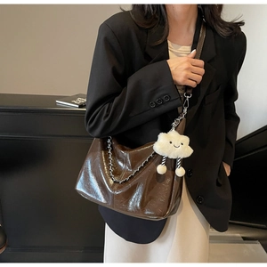 Deep brown patent leather Hobo tote bag with metal chain and white cloud plush charm