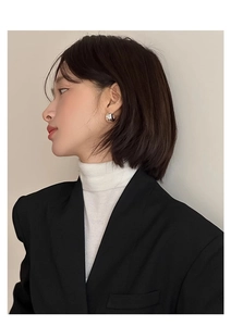 Polished silver irregular dome earring shown on model with chic minimalist styling