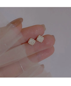 Close-up of square geometric stud earrings with micro-pave white zircon settings