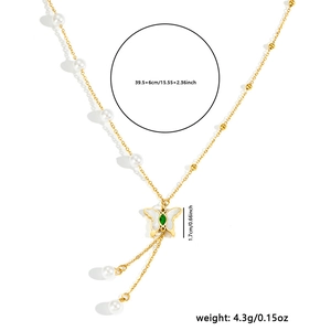 Gold butterfly necklace with green zircon and pearl tassel pendant on fine link chain