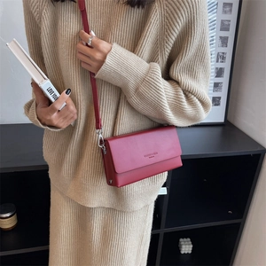 Chic red leather crossbody bag for women with minimalist rectangular structure