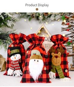 Three-piece red and black plaid Christmas gift bags with snowman, Santa, and reindeer