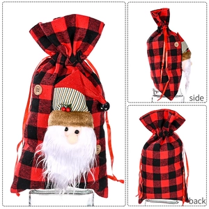 Detailed views of red and black buffalo plaid Christmas gift bag with Santa Claus applique