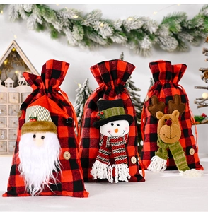 Detailed view of plaid Christmas gift bags with 3D Santa, Snowman and Reindeer dolls