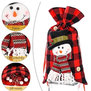 Christmas snowman gift bag with red black buffalo plaid pattern and drawstring closure