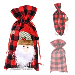Christmas red and black buffalo plaid drawstring gift bag with 3D Santa Claus decoration