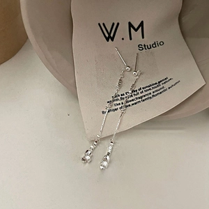 Elegant long silver tassel drop earrings with geometric pendants and minimalist chains