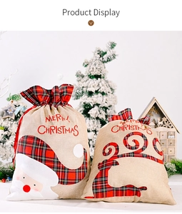 Detail of Christmas burlap gift bags with plaid applique Santa and reindeer designs