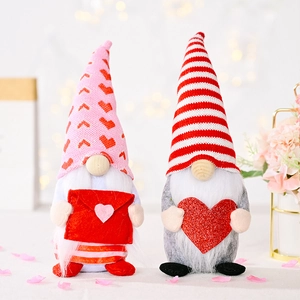 Detail of two Valentine Gnomes with heart patterns, envelopes and sequined heart decor