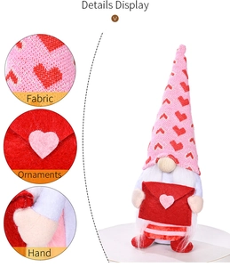 Detail display of Valentine gnome doll showing fabric texture and felt heart envelope