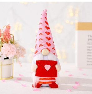 Detail of Valentine gnome holding a red envelope with heart on a romantic floral background
