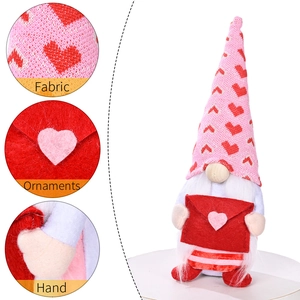 Valentine gnome plush with red heart envelope and pink knitted hat on white background