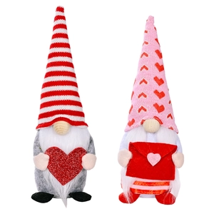 Valentine's Day gnome plush set with striped hats holding a glitter heart and love letter