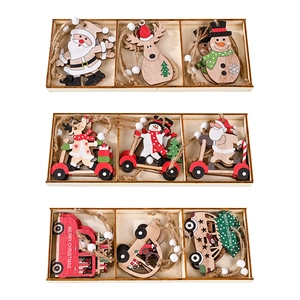 Set of wooden Christmas tree ornaments with Santa Claus, reindeer, and snowman in a box