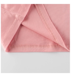 Detailed close-up showing double-stitched hem on soft pink cotton girls long sleeve T-shirt