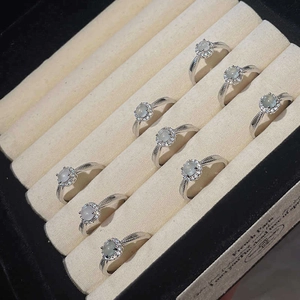 Elegant cat eye stone rings with zircon accents displayed in a jewelry box organizer