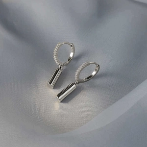 Minimalist silver geometric cylinder drop hoop earrings with zircon pavé inlay
