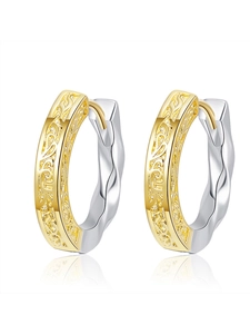 Detail of two-tone hollow vine engraved ear buckles with silver twisted rope texture