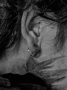 Detailed close-up of S925 sterling silver earrings with retro gothic floral engraving