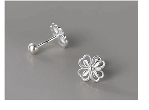 Detailed macro view of S999 sterling silver clover earrings with screw-back design