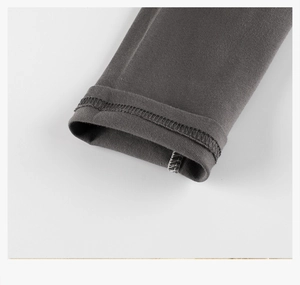 Detailed macro view of dark grey cotton raglan tee sleeve with double-needle stitching