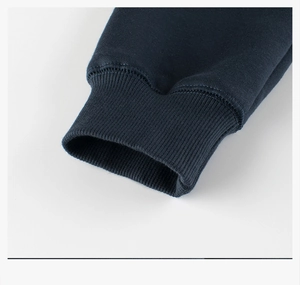 Close-up of navy blue ribbed cuffs on children's fleece sweatshirt showing fabric texture