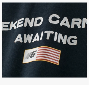 Detail of boys fleece sweatshirt showing high-quality college style graphic print on navy fabric