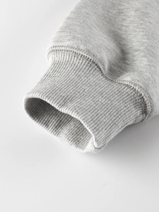 Close-up of grey polar fleece hoodie with elastic ribbed knit cuffs for boys