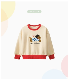 Detail of cream kids sweatshirt with red ribbed neck and cute dog towel embroidery