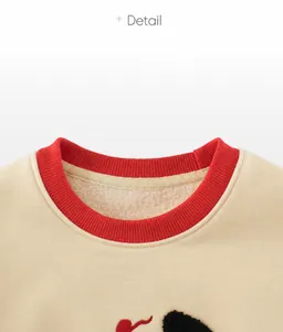 Detail of children's crewneck sweatshirt featuring red ribbed collar and fleece lining