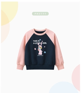 Detail of kids cartoon girl print on navy and pink raglan sleeve sweatshirt fabric