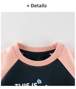 Detail of navy and pink toddler sweatshirt showing ribbed collar and soft fleece lining