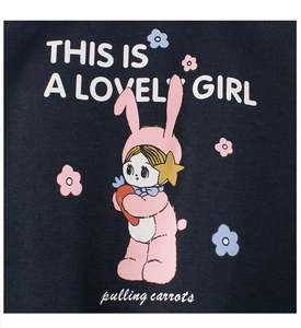 Close-up of girl in rabbit suit cartoon print on navy blue fleece sweatshirt fabric