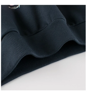 Detailed close-up of ribbed cuffs on children's navy hoodie with Falling print