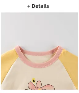 Detail of pink ribbed crewneck and raglan sleeves on floral print kids cotton t-shirt