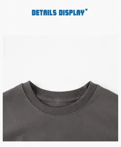 Close-up of the ribbed crew neck and double stitching on boys dinosaur t-shirt