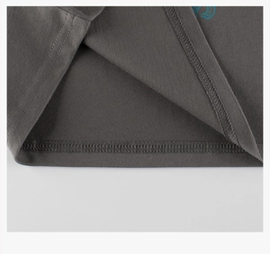 Detailed close-up of charcoal grey cotton knitted t-shirt hem with double stitching