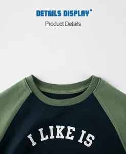 Detail view of raglan sleeve kids t-shirt with crew neck and letter print