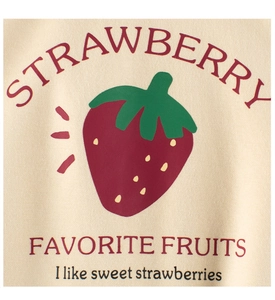 Detail of warm beige kids sweatshirt fabric featuring a red strawberry graphic and text