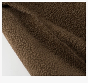 Detail of warm brown fleece fabric showing soft texture for children's winter sweaters